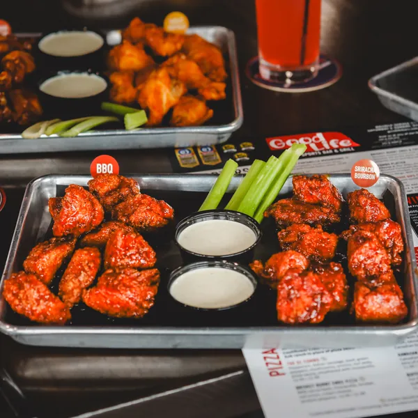 Wings with dipping sauces and vegetables